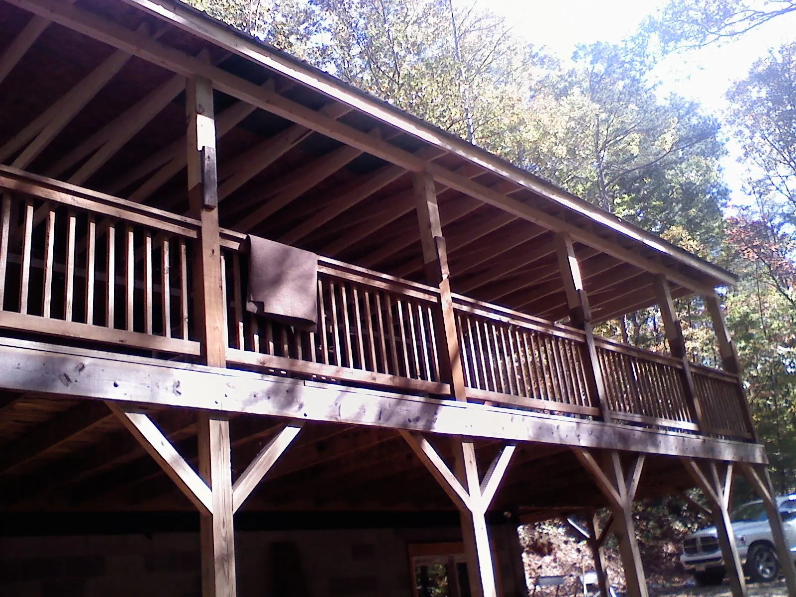 Timber framing under a new elevated porch and deck — Roof Leak Repair in Florida by Roofing Brothers